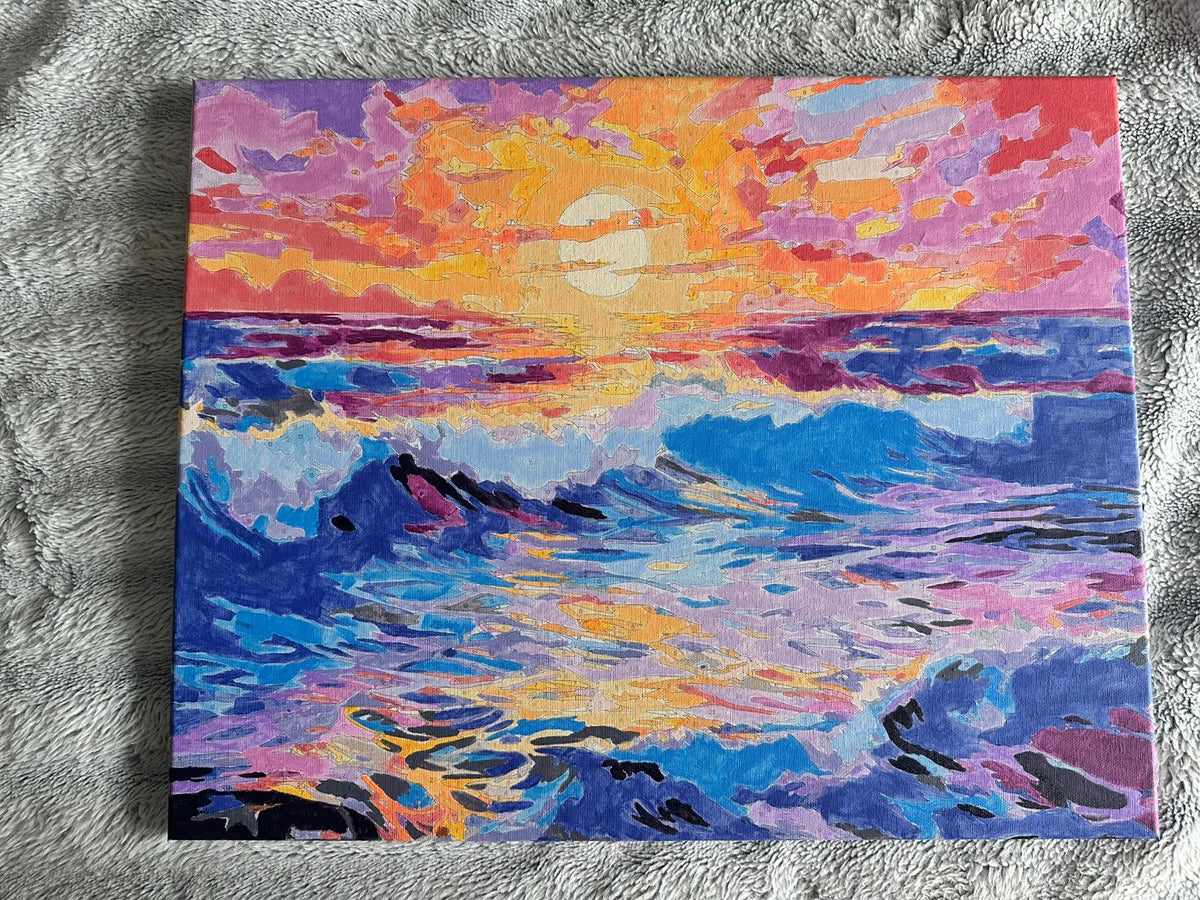 Détail d’un tableau de coucher de soleil sur la mer.